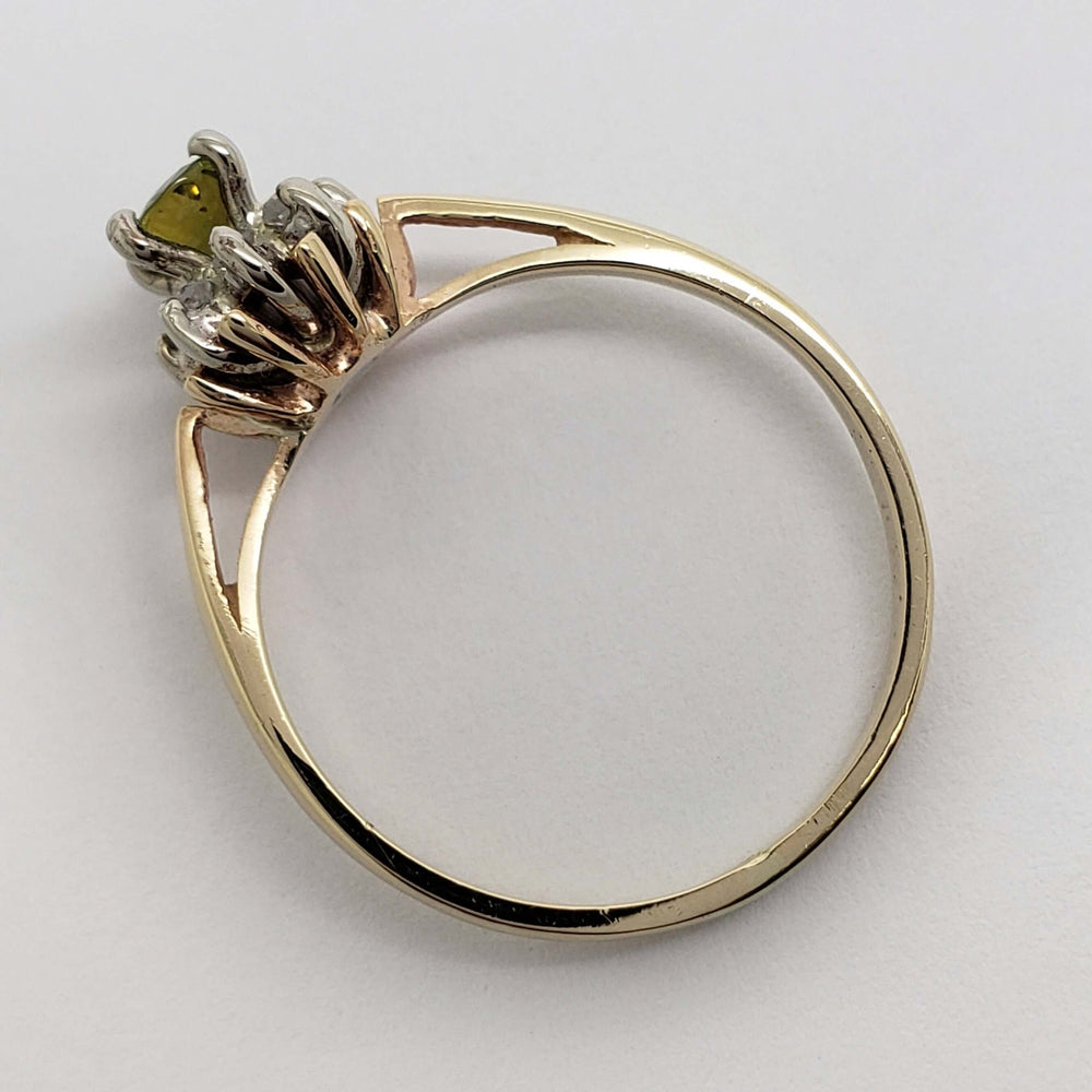 Side profile of 10kt yellow gold ring showing sapphire and diamond halo setting