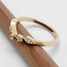Side view of 14k yellow gold leaf diamond ring on a wooden stick