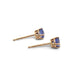 Side view of 14kt gold tanzanite stud earrings with round stones in four-claw settings