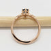 Side view of 14kt rose gold Montana sapphire ring with leaf-inspired setting