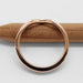 Side view of 14kt rose gold chevron band showing polished finish