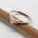Side view of 14kt rose gold chevron diamond wedding ring on a pencil