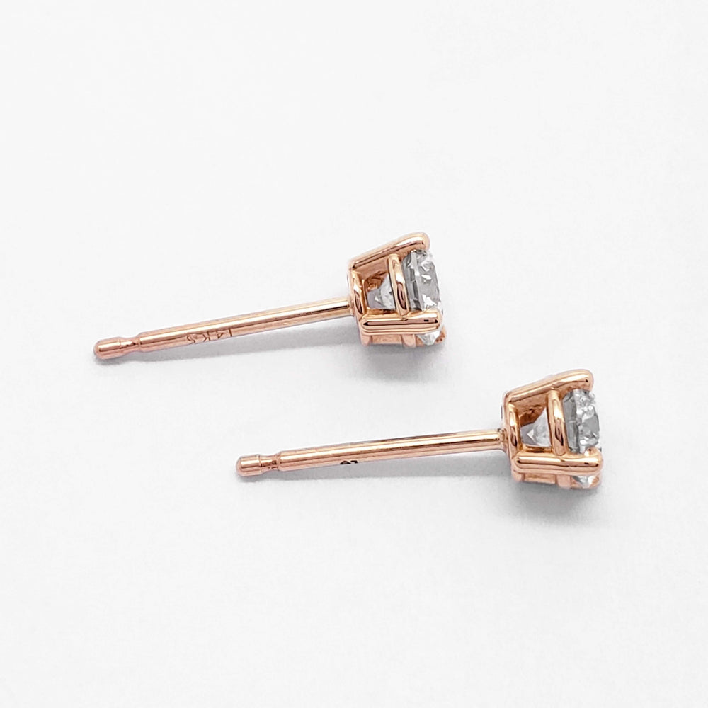Side view of 14kt rose gold lab diamond stud earrings showing four-claw setting
