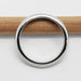 Side view of 14kt white gold chevron wedding ring on a pencil