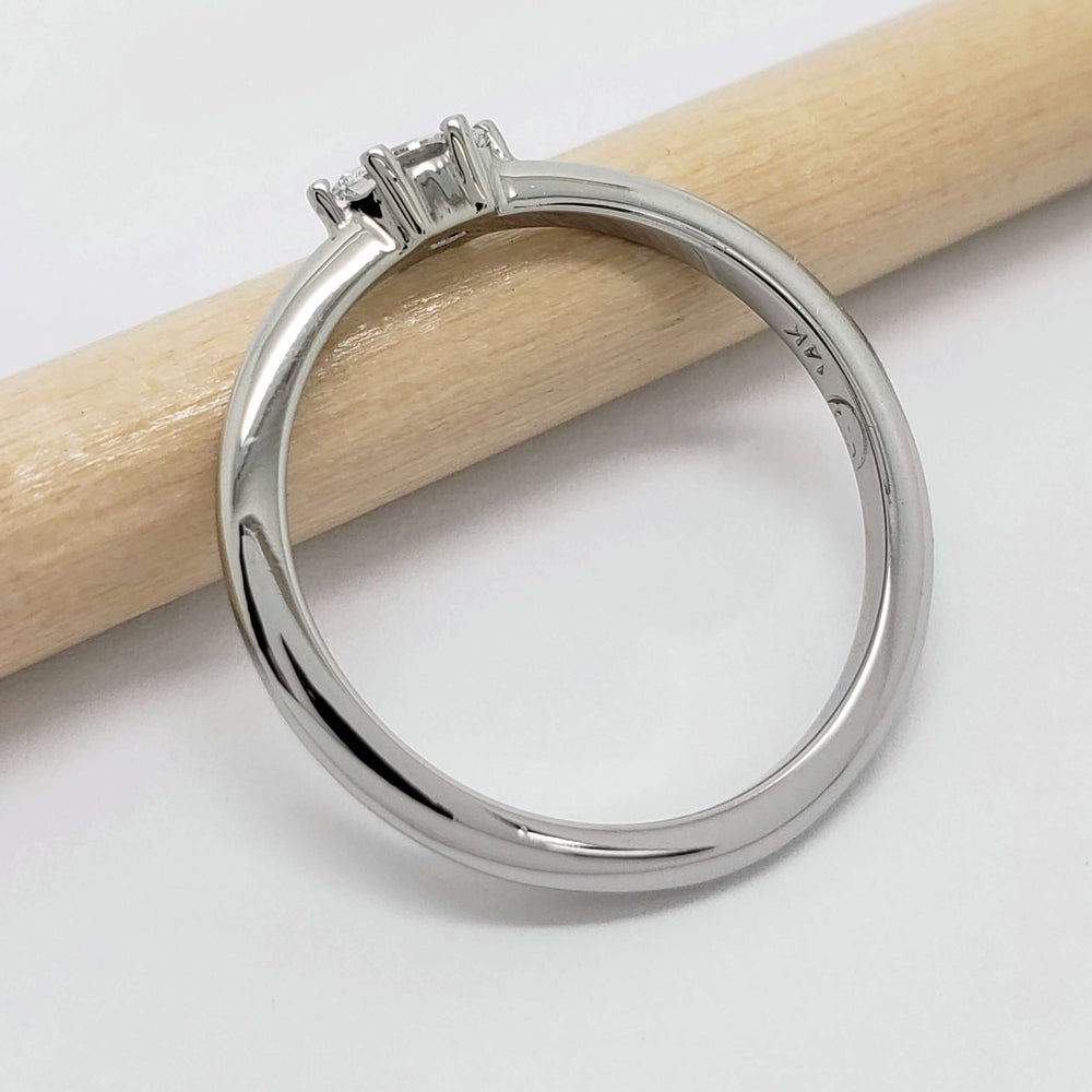 Side view of 14kt white gold engagement ring with marquise lab diamond
