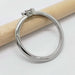 Side view of 14kt white gold engagement ring with marquise lab diamond