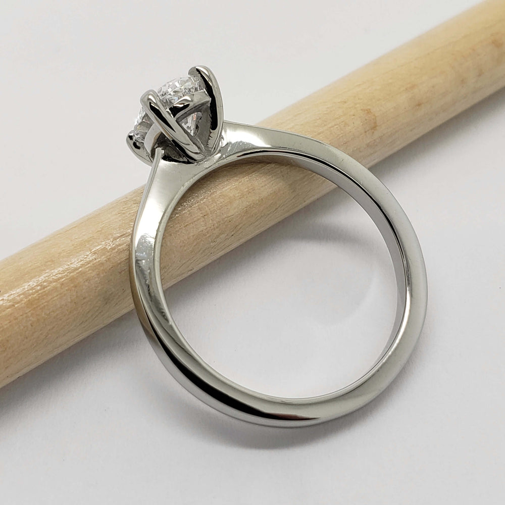 Side view of 14kt white gold oval lab diamond ring showing the basket setting