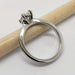 Side view of 14kt white gold oval lab diamond ring showing the basket setting
