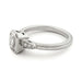 Side view of 14kt white gold ring with emerald cut lab diamond and pave-set side diamonds