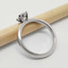 Side view of 14kt white gold solitaire ring with round lab diamond on a pencil