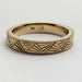 Side view of 14kt yellow gold Art Deco engraved wedding band with millgrain detail