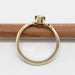Side view of 14kt yellow gold Montana sapphire ring with leaf-inspired shoulders