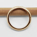 Side view of 14kt yellow gold chevron wedding ring on a wooden stick