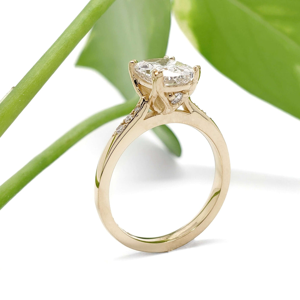 Side view of 14kt yellow gold engagement ring with cushion cut lab diamond and pave-set shoulders