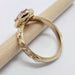 Side view of engraved 14kt yellow gold ring band with millgrain and floral pattern, diamond halo setting