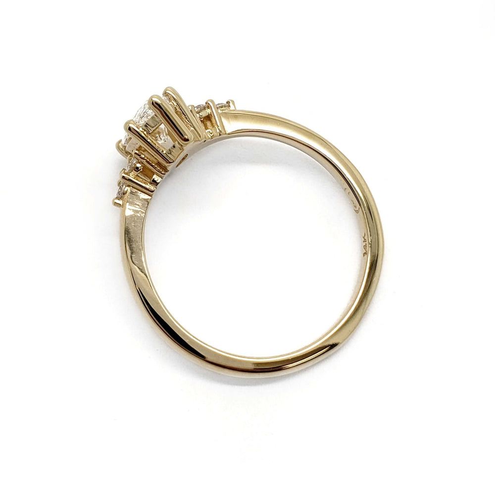 Side profile of 14kt yellow gold ring with marquise lab diamond setting