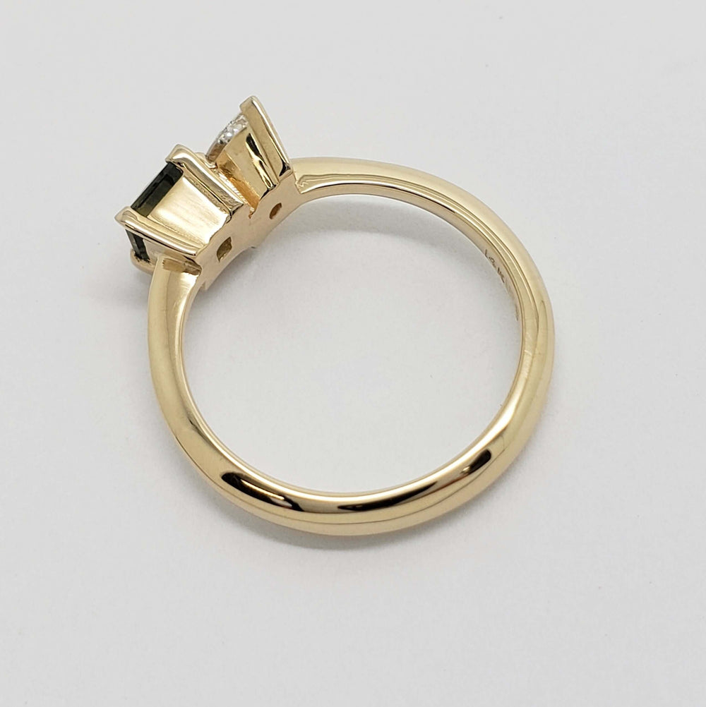 Side view of 14kt yellow gold ring setting with diamond and teal sapphire