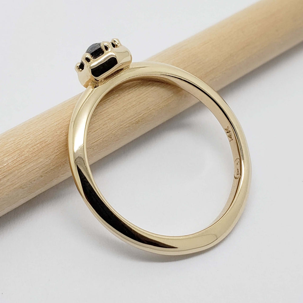 Side profile of 14kt yellow gold ring with hexagon salt and pepper diamond setting