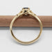 Side view of 14kt yellow gold ring with teal Montana sapphire and diamond accents