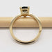 Side profile of 14kt yellow gold ring with trillion teal Australian sapphire