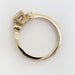 Side view of a 14kt yellow gold ring showing vintage diamond setting and band details