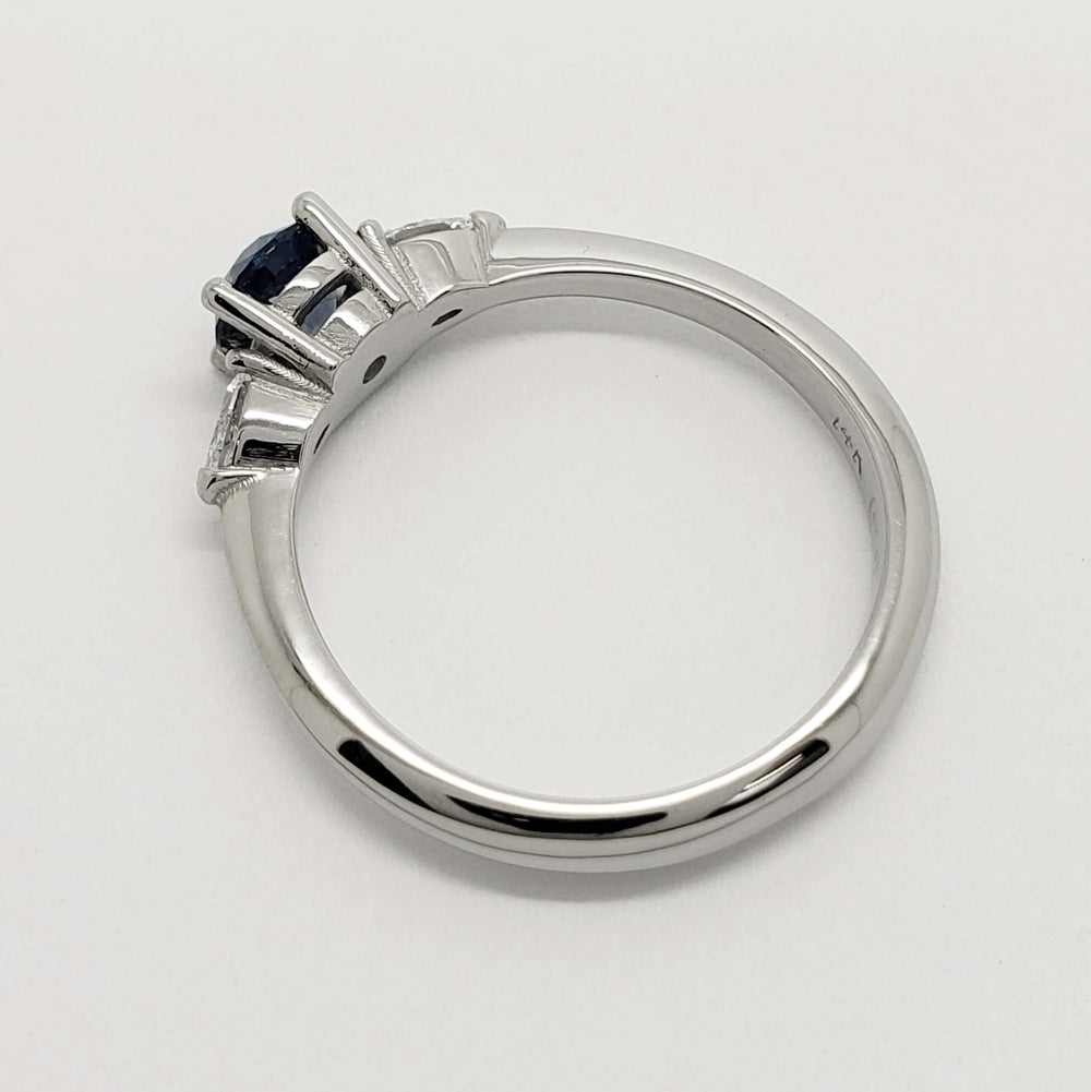 Side profile of 14kt white gold Montana sapphire and lab diamond engagement ring