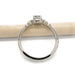 Side profile of 14kt white gold Montana sapphire engagement ring beside a pencil