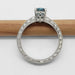 Side view of engraved 14kt white gold ring with blue Montana sapphire and diamond accents