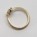Side view of engraved 14kt yellow gold band with pear lab diamond setting