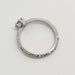 Side view of engraved white gold ring band and diamond setting