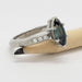 Side view of engraved white gold ring with marquise Australian sapphire and Canadian diamonds