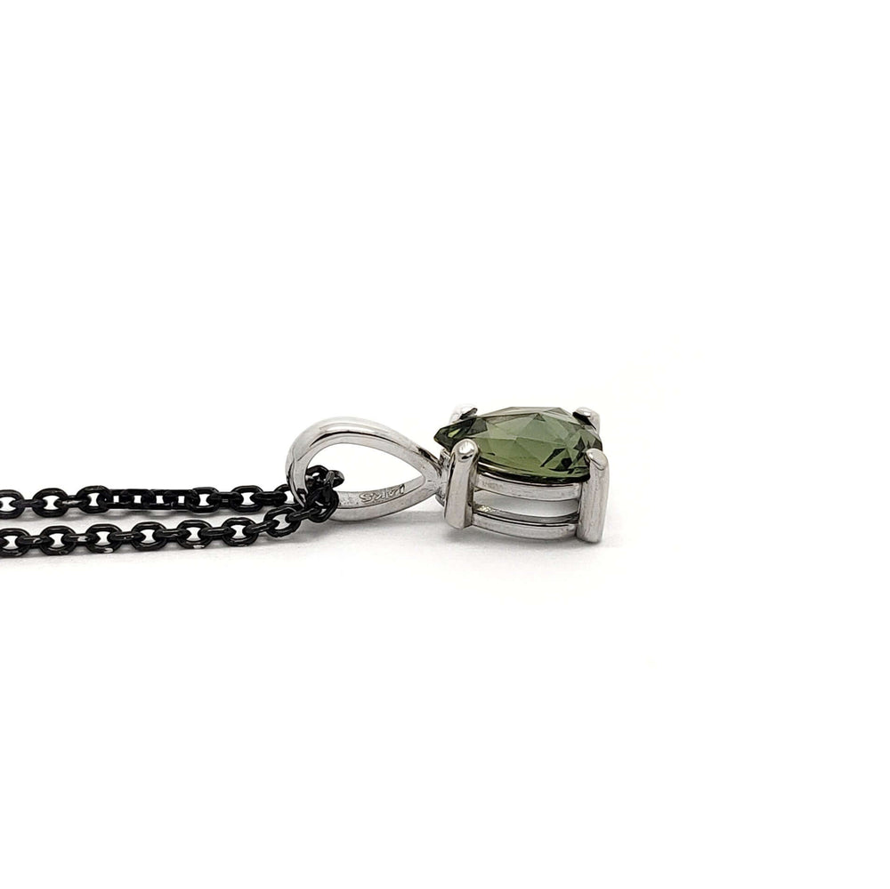 Side view of pear rose cut green sapphire pendant in 14k white gold on black chain