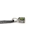 Side view of pear rose cut green sapphire pendant in 14k white gold on black chain