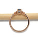 Side profile of 14kt rose gold Montana sapphire and diamond ring showing setting details