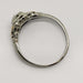 Side view of vintage 14kt white and yellow gold diamond ring with openwork details