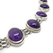 Side view of vintage sterling silver bracelet with cabochon amethysts