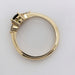 Side profile of yellow gold ring showing setting of Montana sapphire and lab diamonds