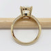 Side view of yellow gold engagement ring with pave-set lab diamonds on split shank band