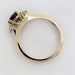 Side view of yellow gold ring with teal Australian sapphire and lab diamonds