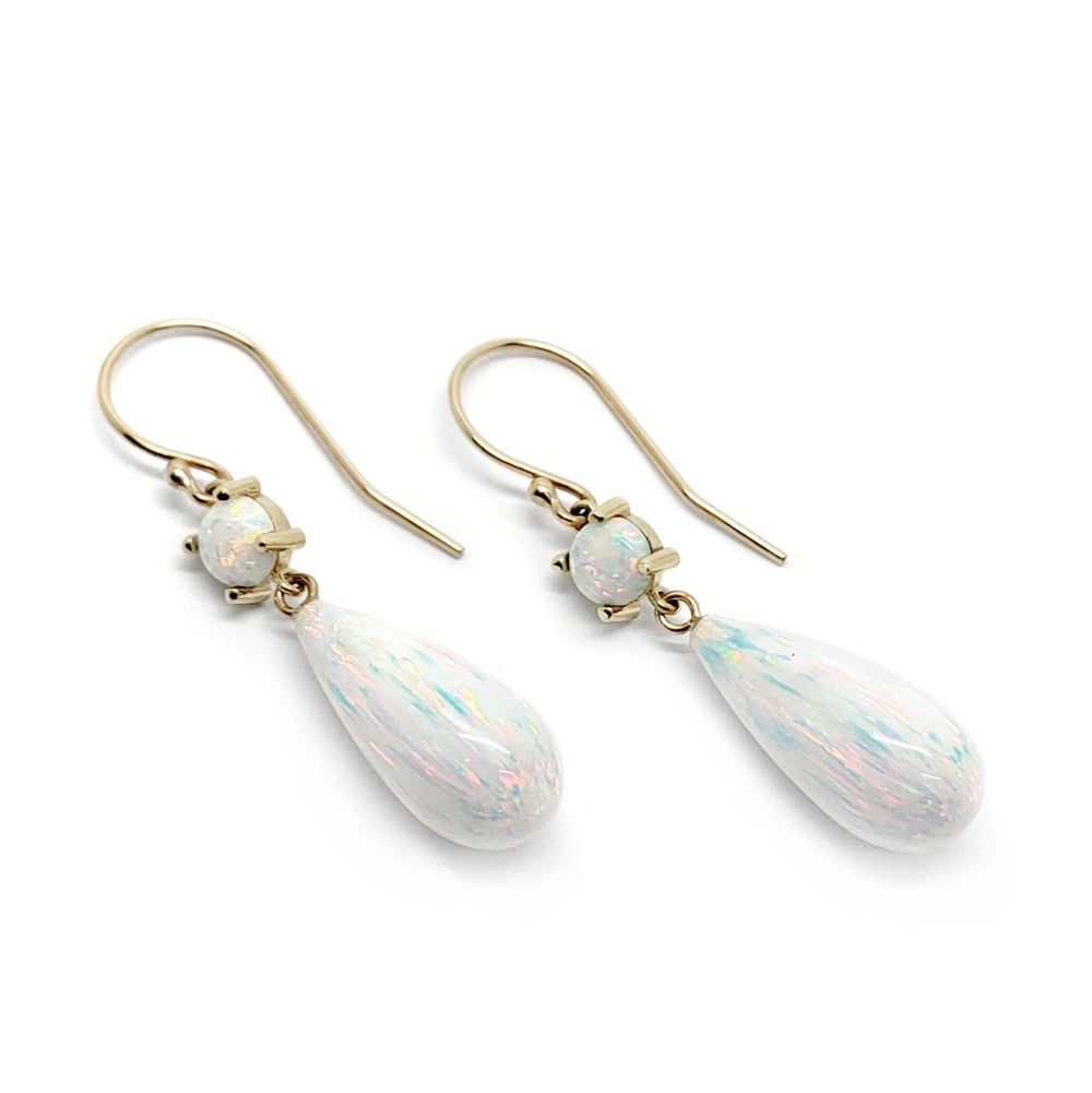 Simulated opal dangle earrings in 14kt yellow gold with round and teardrop stones