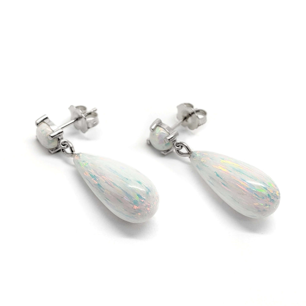 Simulated opal drop earrings in 14kt white gold on white background