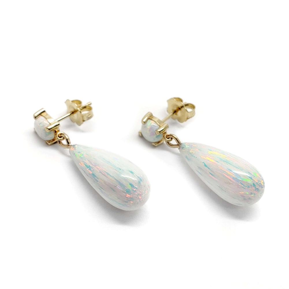Simulated opal drop earrings in 14kt yellow gold on white background