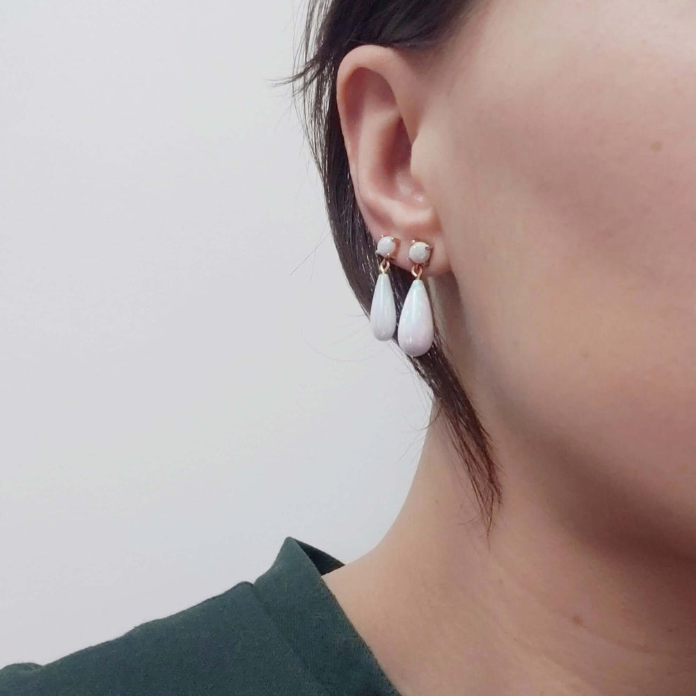 Simulated opal drop earrings in 14kt yellow gold worn on ear