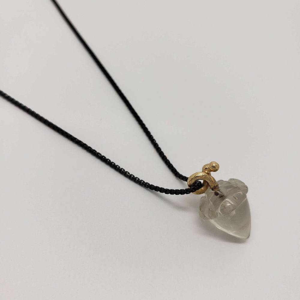 Single smoky quartz acorn pendant with 14kt yellow gold bail on blackened silver chain