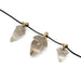 Smoky quartz acorn pendants with 14kt yellow gold bails displayed on a blackened chain