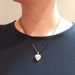 Sterling silver cherub heart locket necklace worn on model