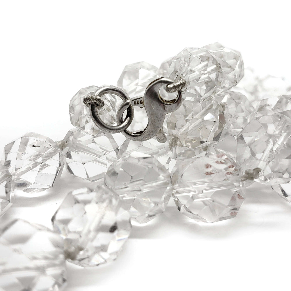 Close-up of sterling silver clasp on clear quartz bead necklace