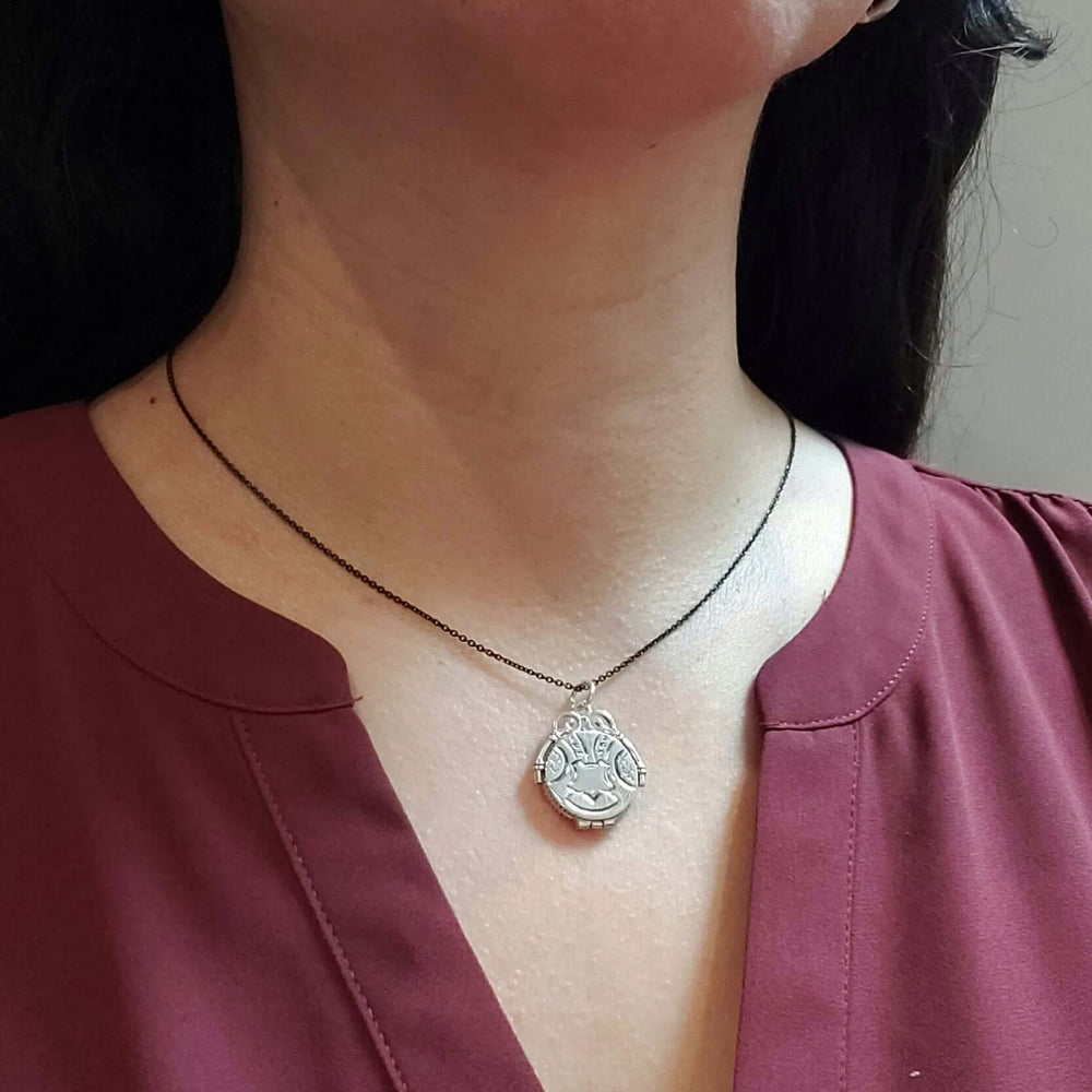 Vintage sterling silver engraved locket necklace shown worn