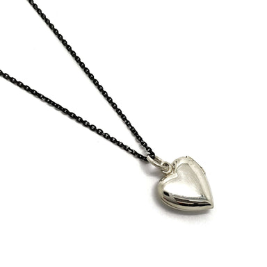 Sterling silver heart-shaped locket on black chain, back view