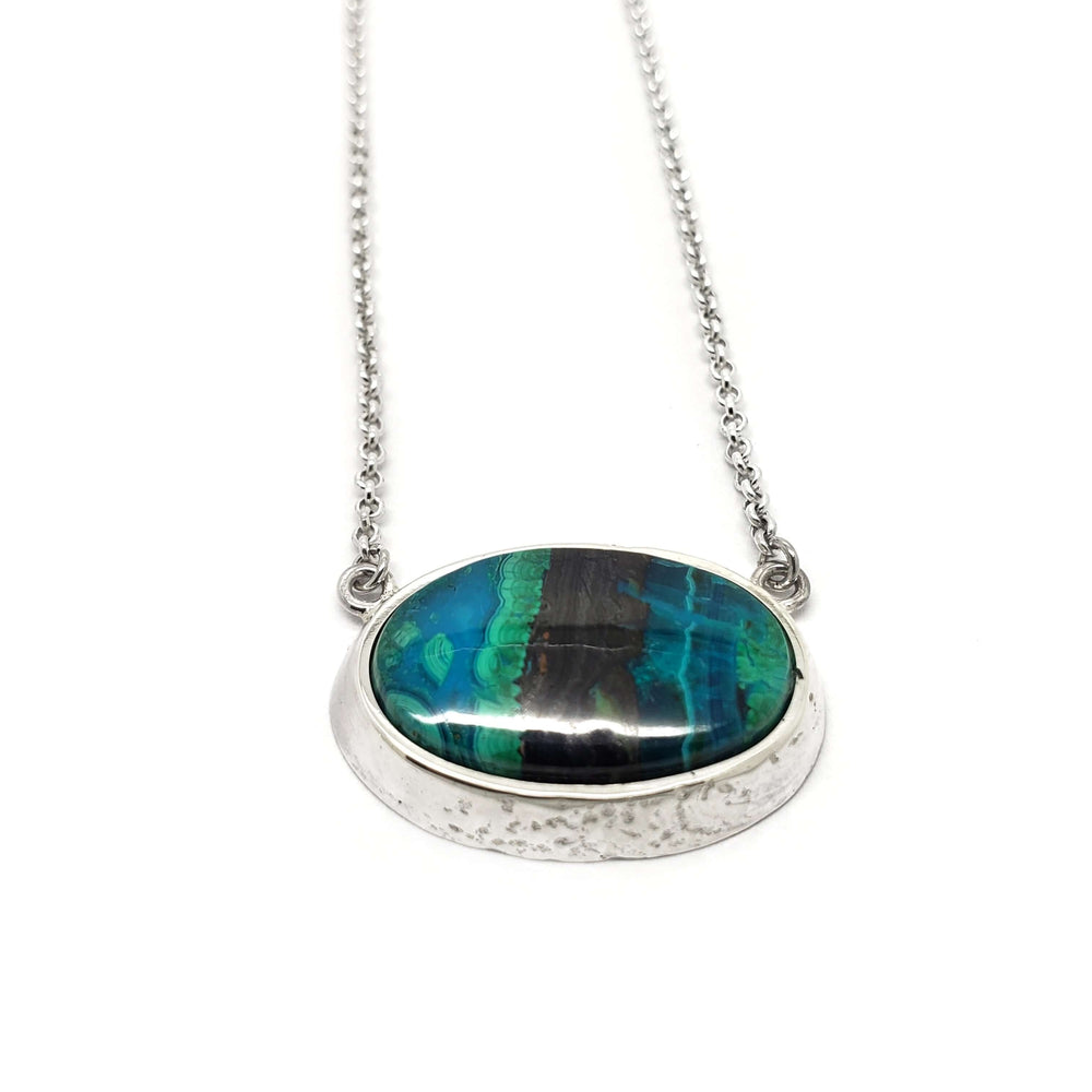 Sterling silver necklace featuring an oval malachite cabochon with banded green and blue hues